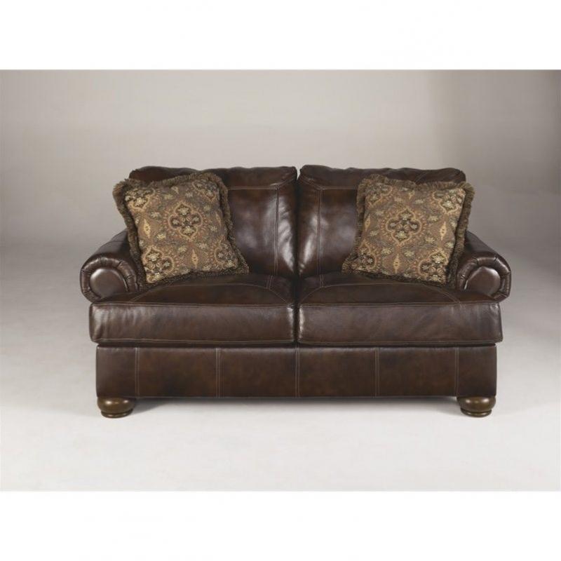 Ashley Furniture Axiom Leather Loveseat in Walnut