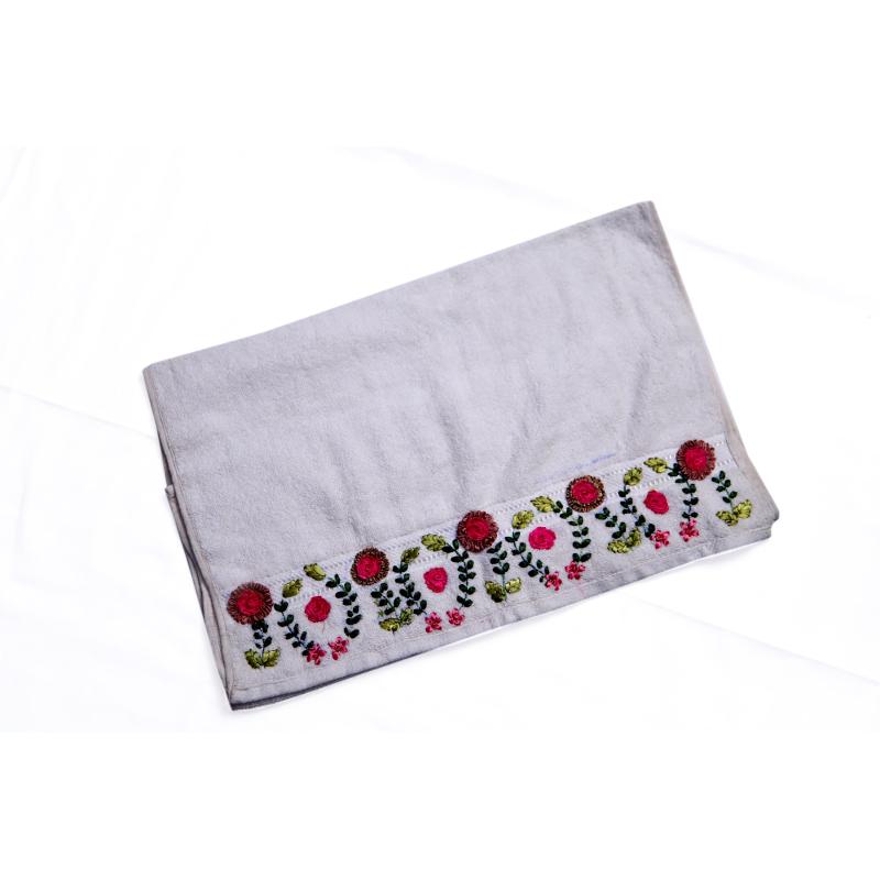 Cotton towel with ribbon work